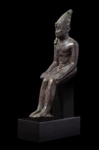 An Egyptian Bronze Seated Harpokrates Height 4 1/4 inches. — LATE PERIOD, DYNASTY 26-30, 664-343 B.C.E.