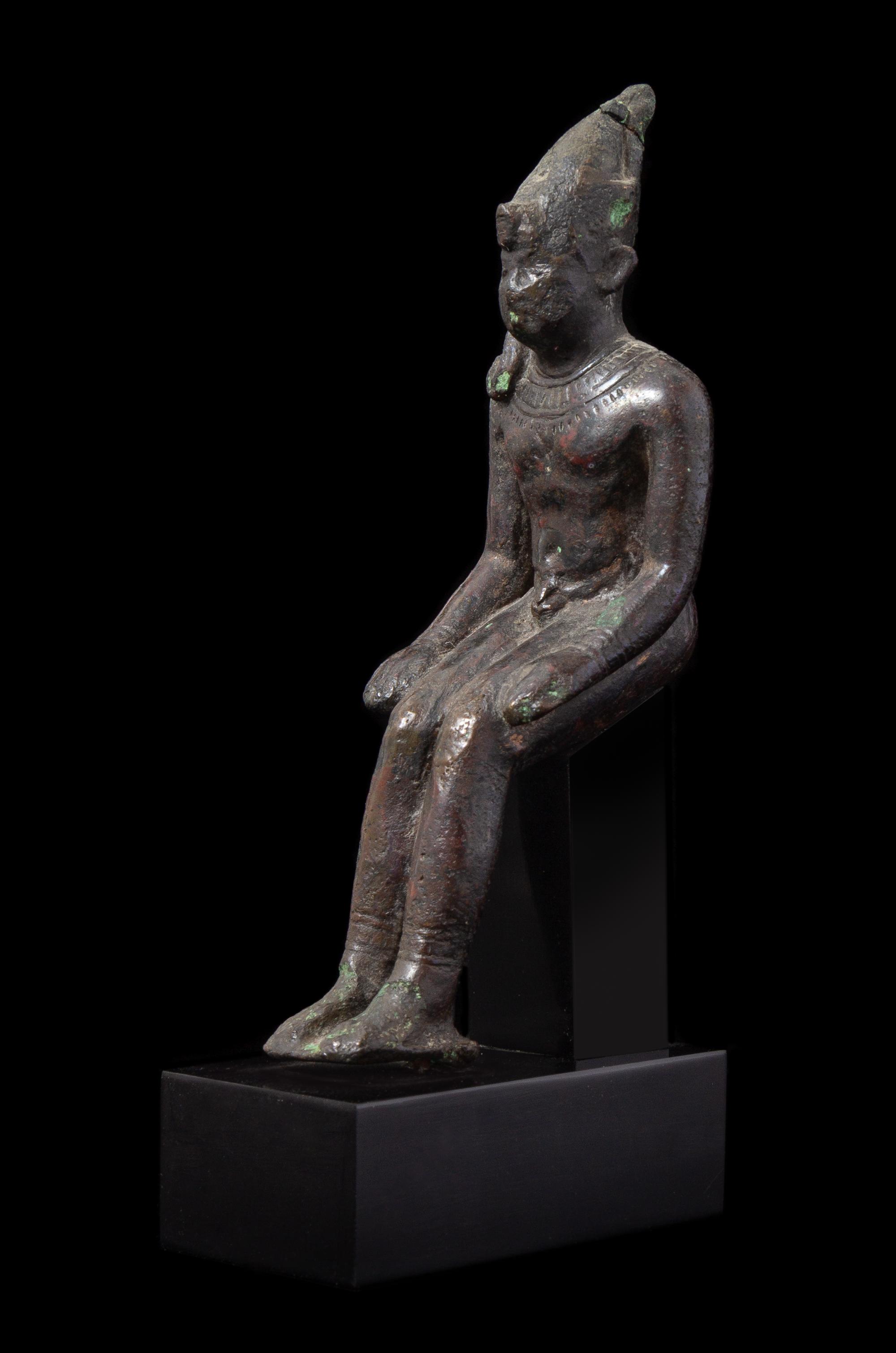 An Egyptian Bronze Seated Harpokrates Height 4 1/4 inches. — LATE PERIOD, DYNASTY 26-30, 664-343 B.C.E.