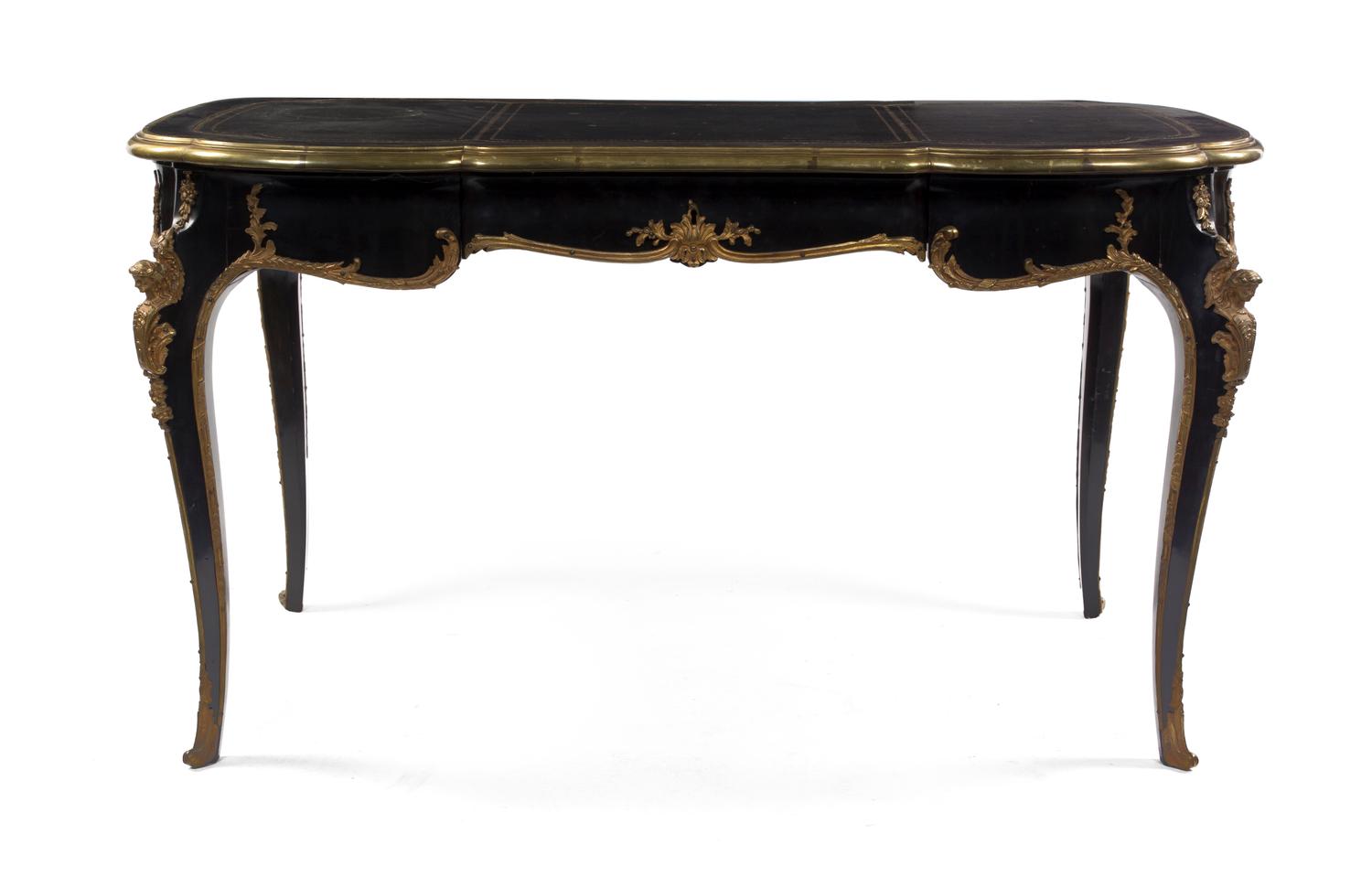 A Napoleon III Ebonized and Gilt Metal Mounted Bureau Plat, Height 29 x width 54 1/2 x depth 29 inches.