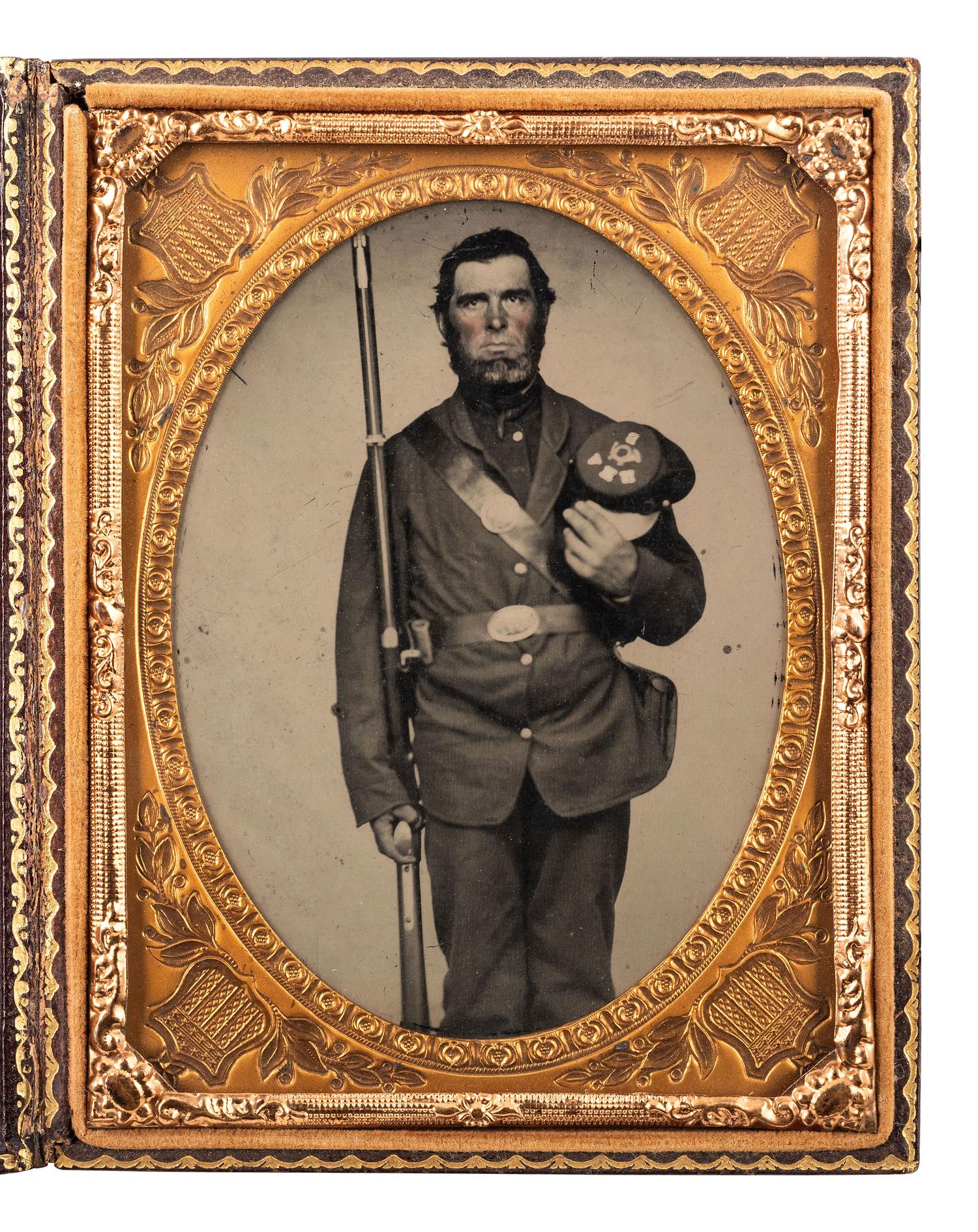 [CIVIL WAR]. Quarter plate ambrotype of an armed New Hampshire Volunteer.