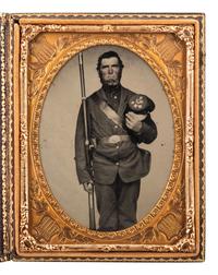 [CIVIL WAR]. Quarter plate ambrotype of an armed New Hampshire Volunteer.