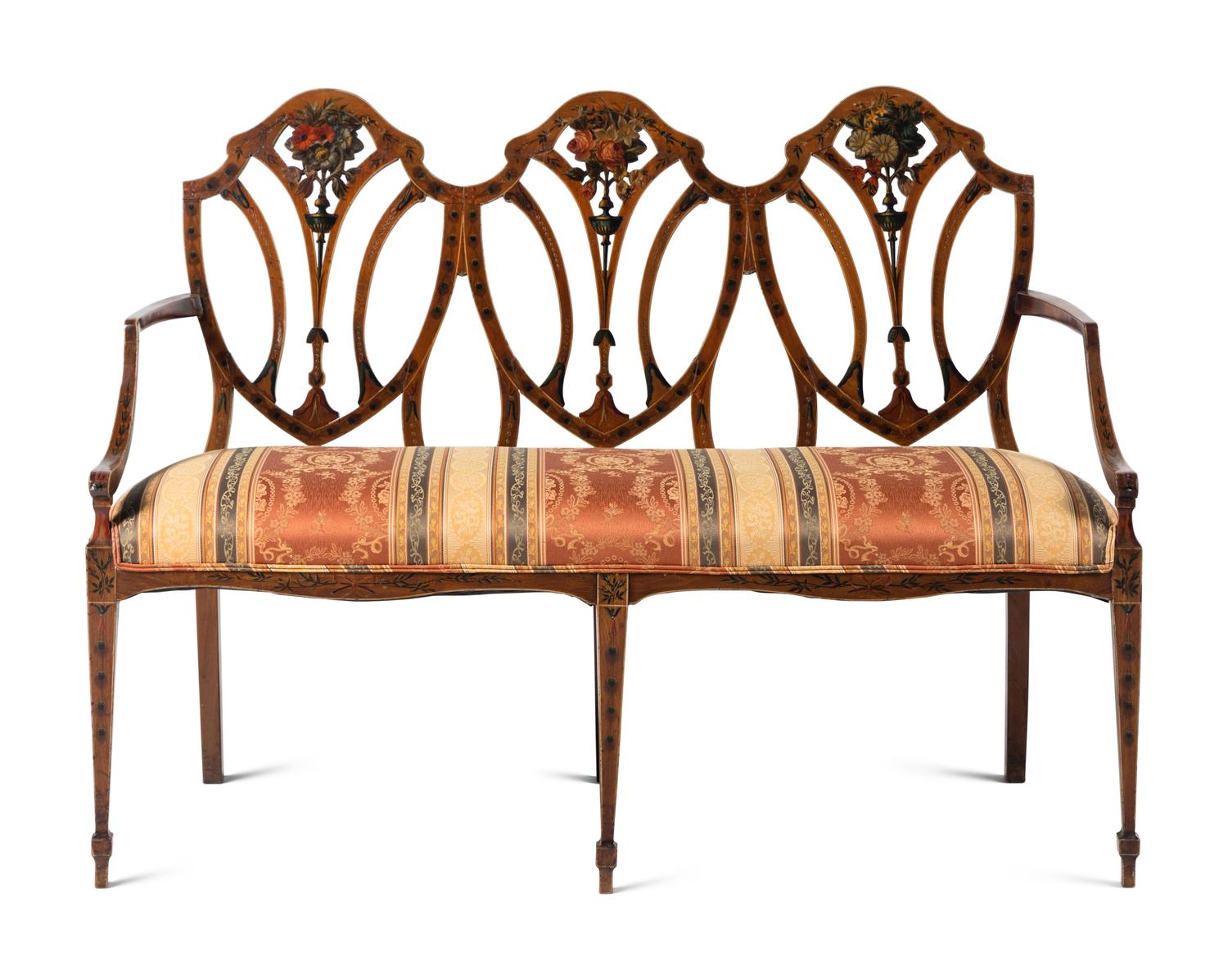 An Edwardian Painted Satinwood Triple-Back Settee and Armchair