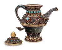 A Tibetan or Himalayan Hardstone Mounted Silver Teapot