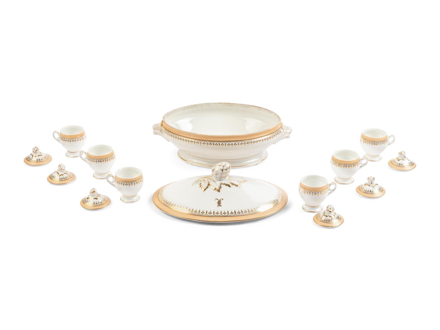 [LINCOLN, Mary Todd (1818-1882)]. A Limoges porcelain buff-ground tureen and cover together with 6 matching pots de crème with covers, purportedly purchased by Mary Todd Lincoln. France, ca. 1865.