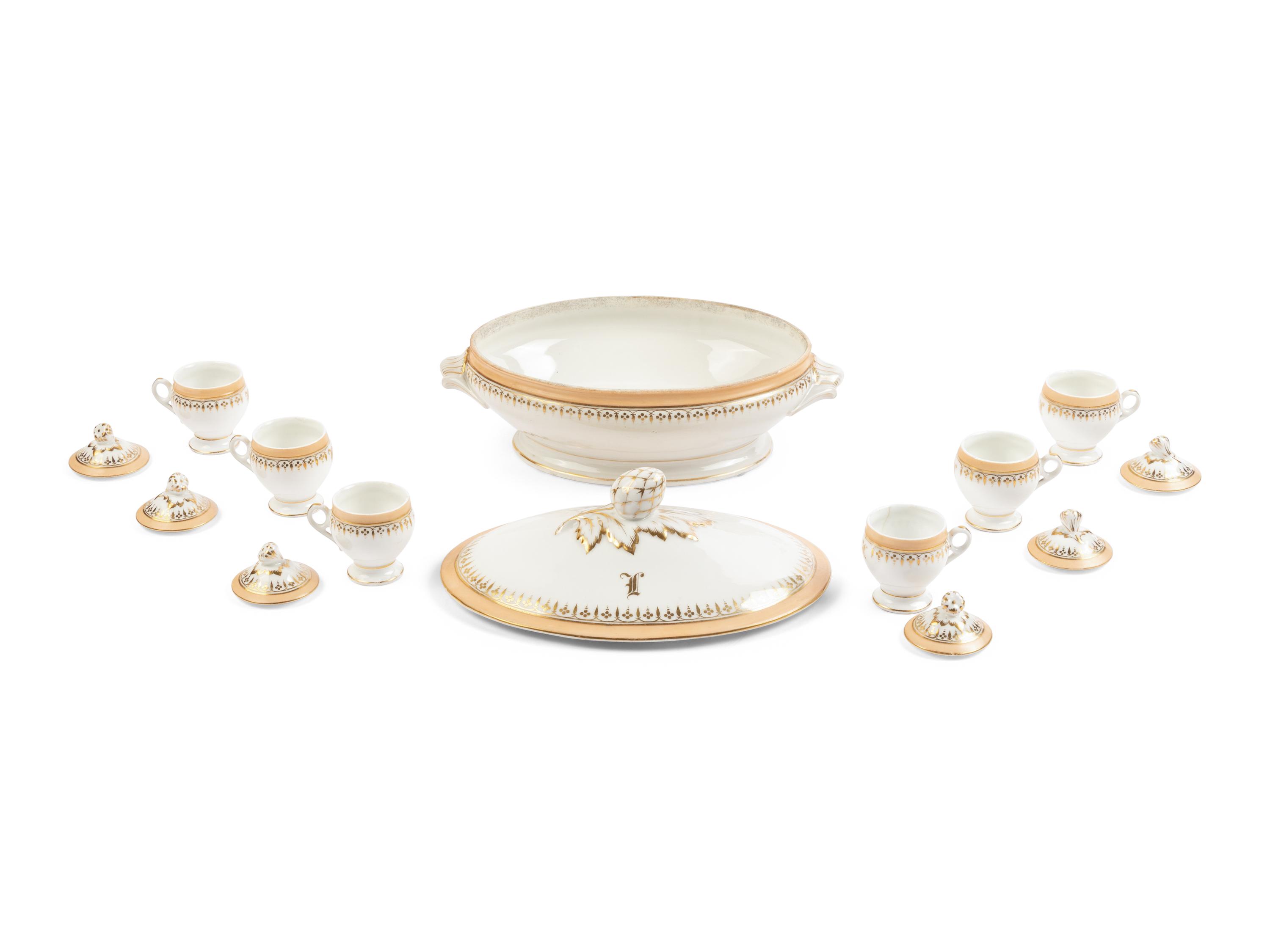 [LINCOLN, Mary Todd (1818-1882)]. A Limoges porcelain buff-ground tureen and cover together with 6 matching pots de crème with covers, purportedly purchased by Mary Todd Lincoln. France, ca. 1865.