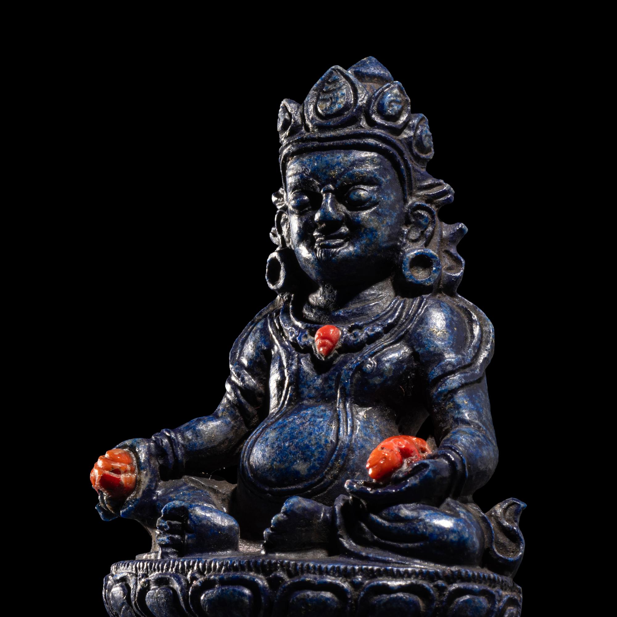 A Sino-Tibetan Carved Lapis Lazuli Figure of Jambhalā