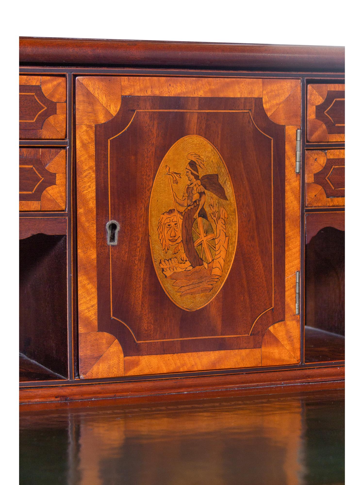 A George III Style Inlaid and Figured Mahogany Leather Inset Carlton House Desk