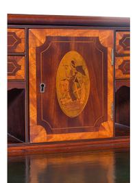 A George III Style Inlaid and Figured Mahogany Leather Inset Carlton House Desk