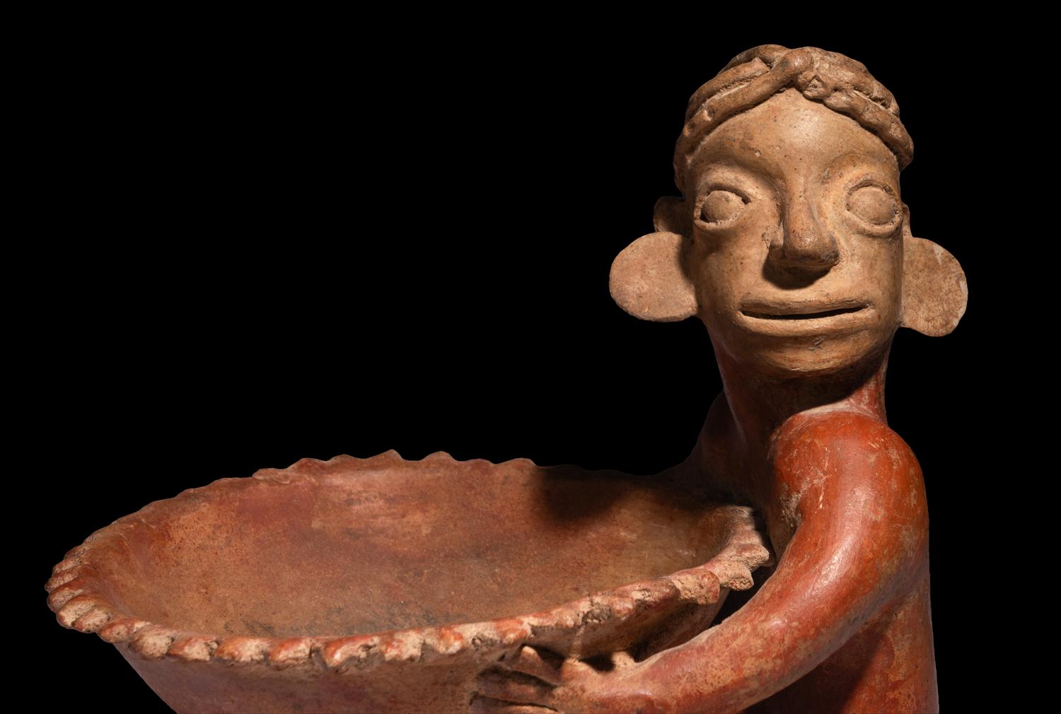 A Jalisco Seated Figure with Offering Bowl