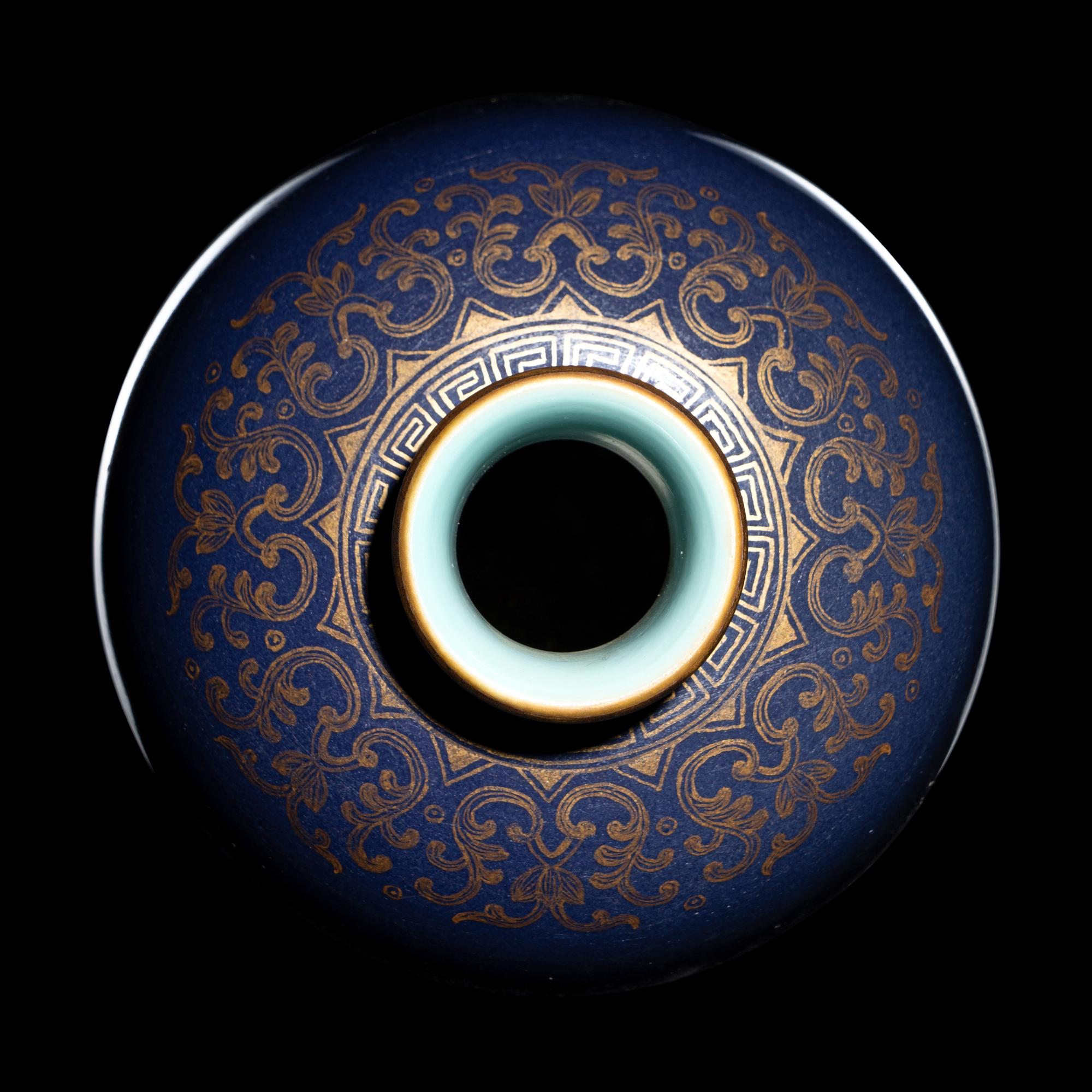 A Small Gilt Decorated Blue Glazed Porcelain Baluster Vase