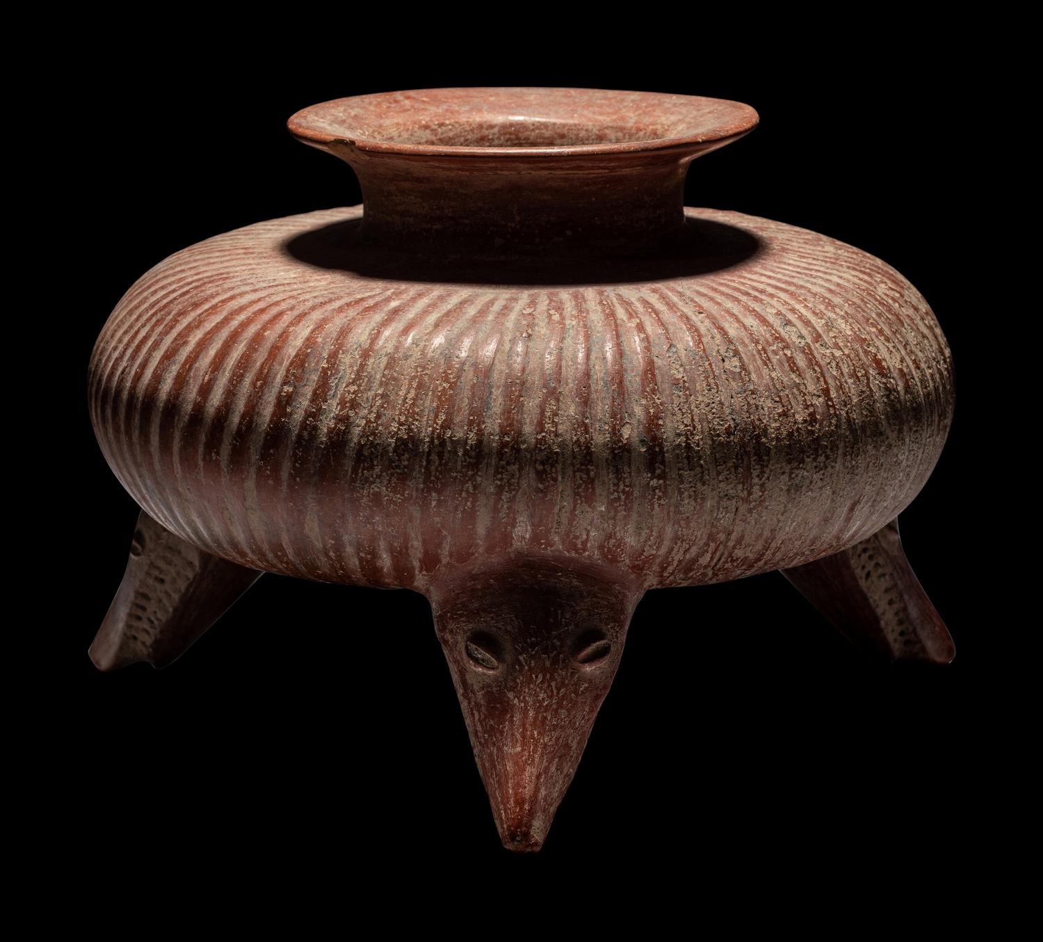 A Colima Gadrooned Vessel with Shark Feet