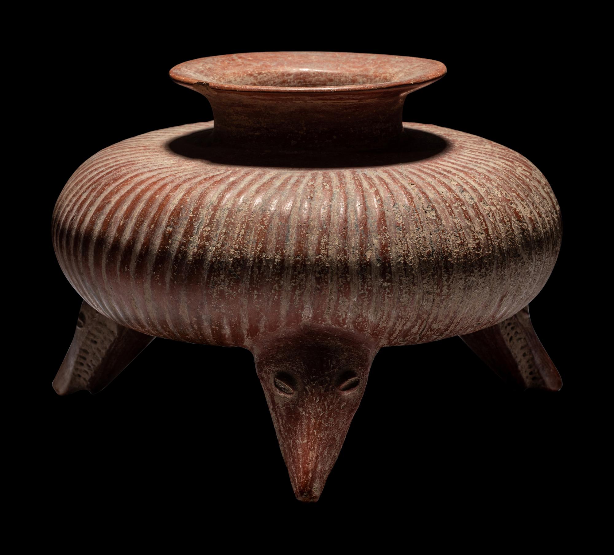 A Colima Gadrooned Vessel with Shark Feet
