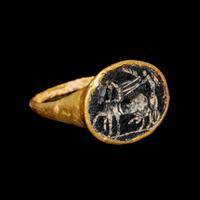 A Roman Gold Finger Ring with an Intaglio of Nike Riding a Chariot