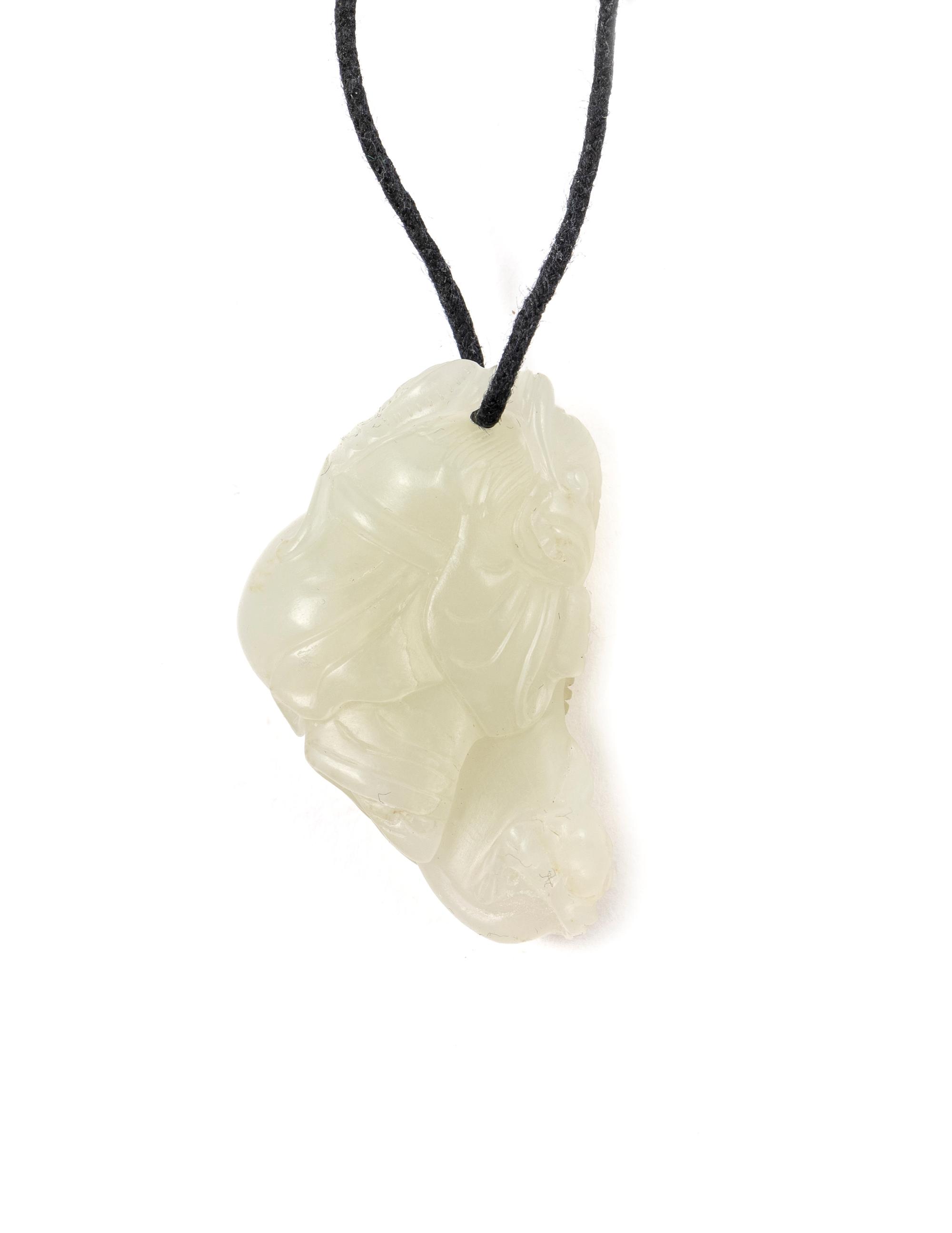 A Chinese Pale Celadon Jade Figure of a Child