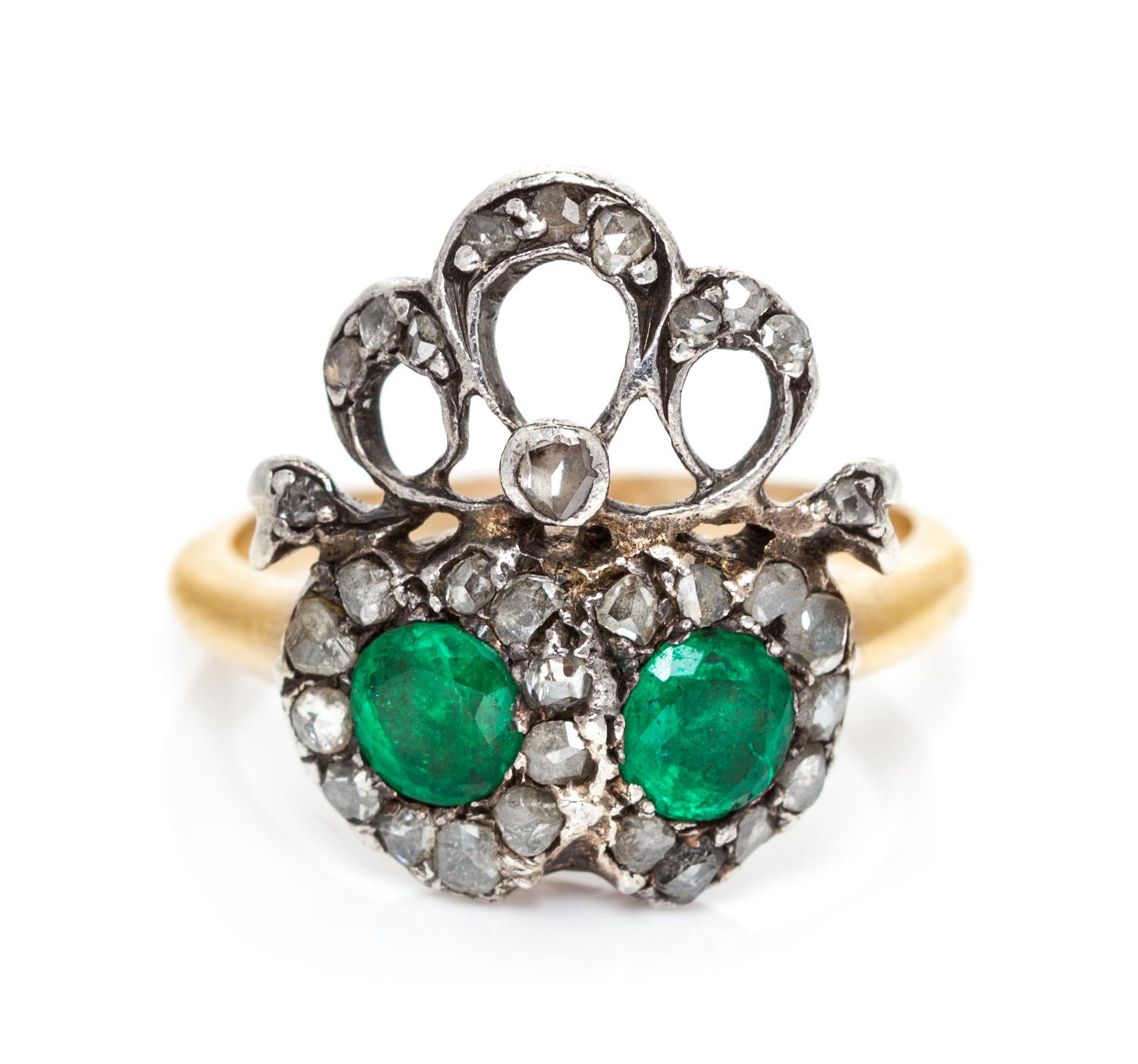 A Victorian Silver, Gold, Emerald and Diamond Double Heart Ring, Circa 1880, 2.70 dwts.