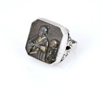 A Sterling Silver Ring with Japanese Metal Work, Diameter of plaque 3/4 inch.