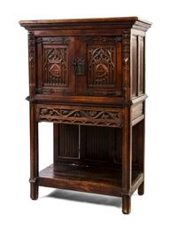 A Continental Gothic Revival Oak Cabinet, Height 55 3/4 x width 34 1/4 x depth 18 1/2 inches.