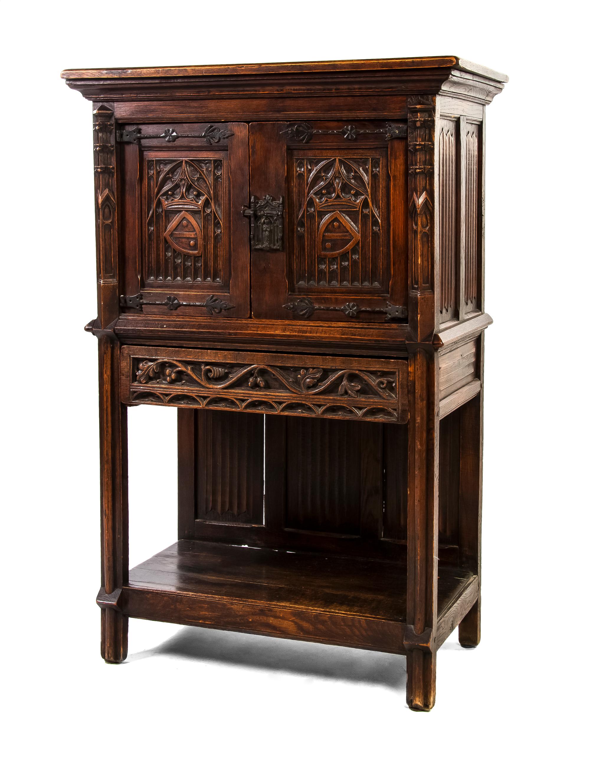 A Continental Gothic Revival Oak Cabinet, Height 55 3/4 x width 34 1/4 x depth 18 1/2 inches.