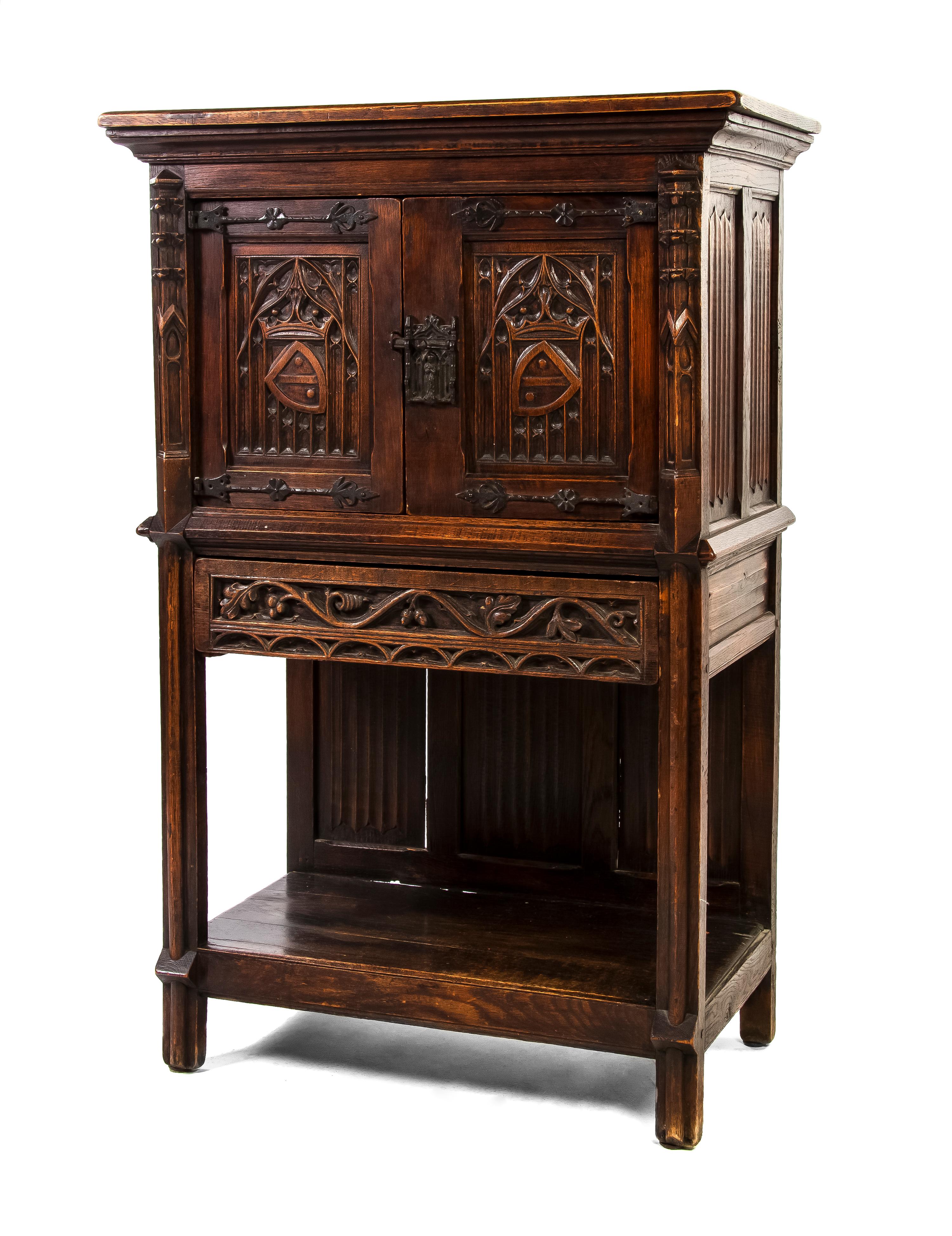 A Continental Gothic Revival Oak Cabinet, Height 55 3/4 x width 34 1/4 x depth 18 1/2 inches.