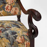 A pair of Baroque Revival carved walnut armchairs late 19th / 20th century