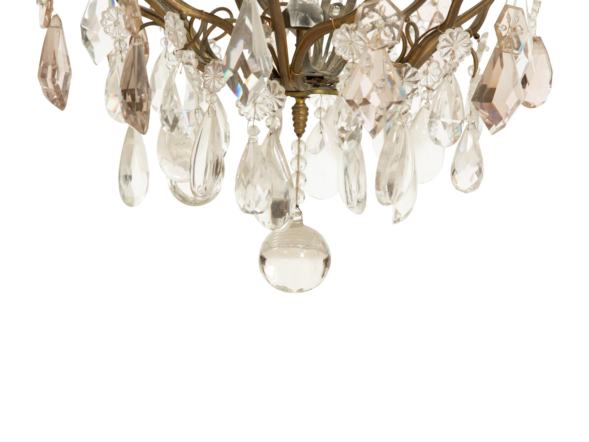 A Louis XV Style Gilt Bronze and Cut Glass Eight-Light Chandelier