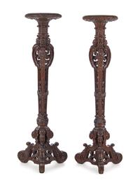 A Pair of Louis XIV Style Carved Oak Torchères