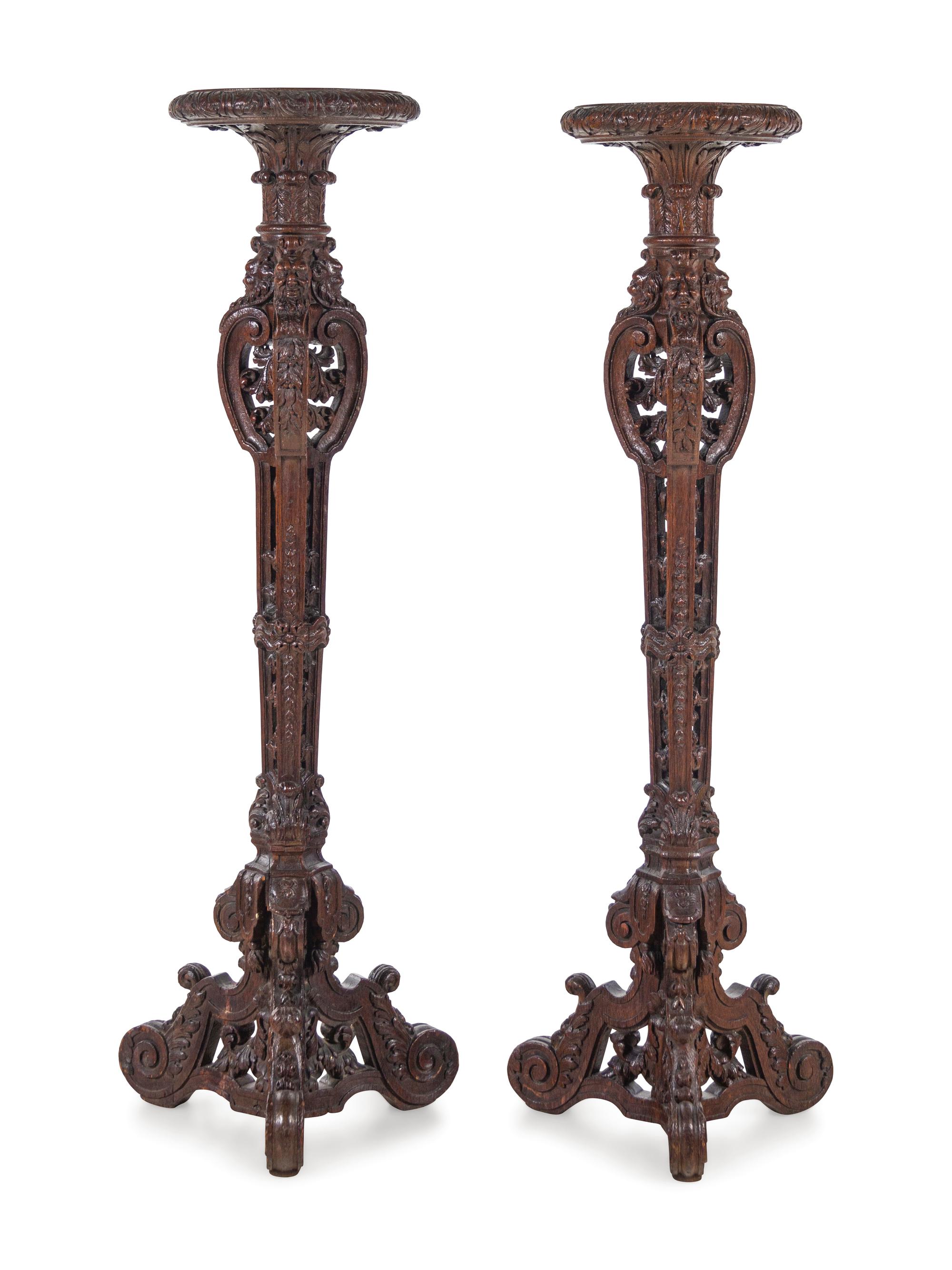 A Pair of Louis XIV Style Carved Oak Torchères