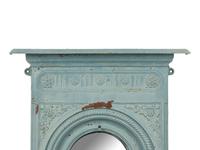 A Patinated Cast Iron Mirror