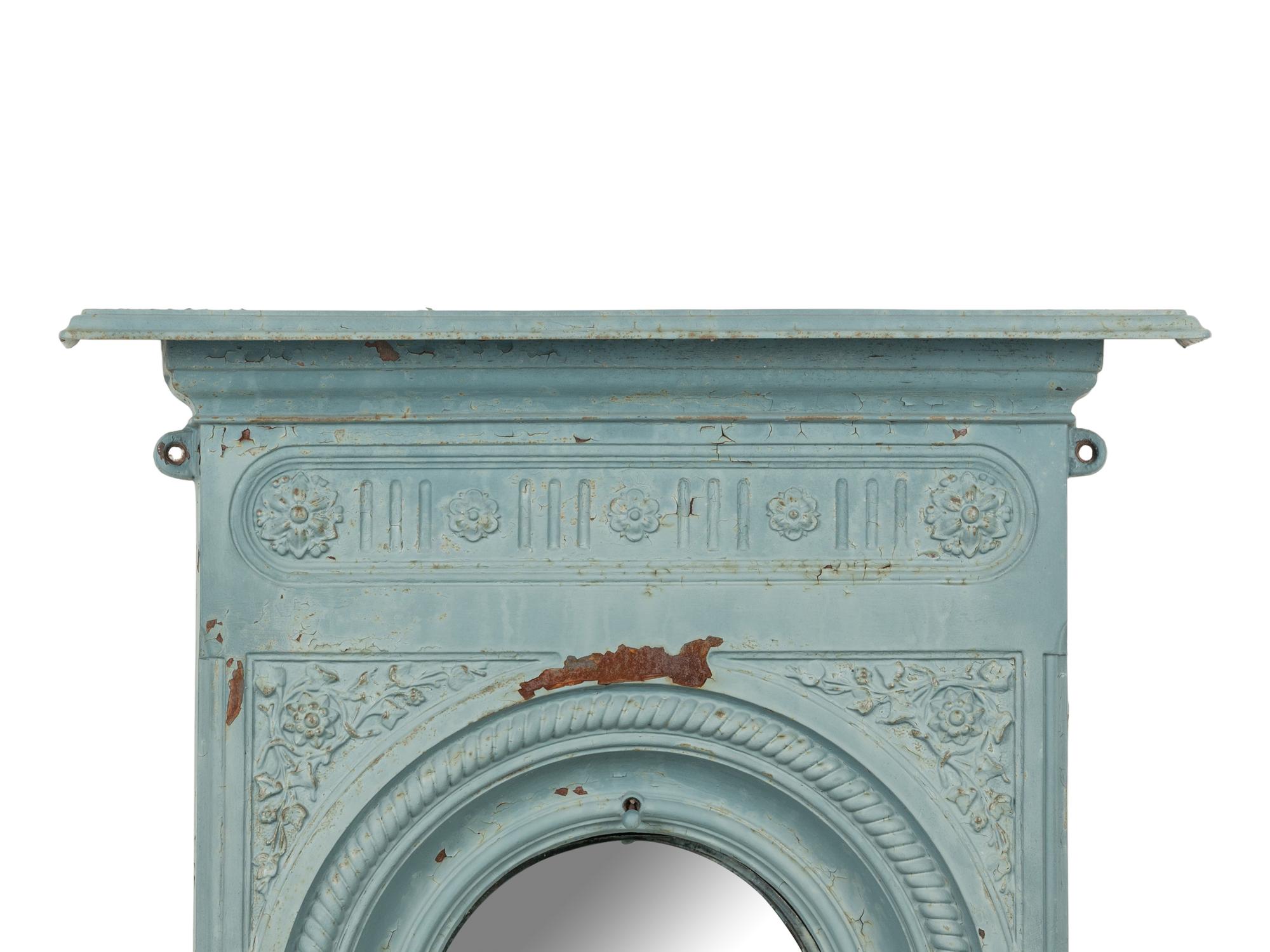 A Patinated Cast Iron Mirror