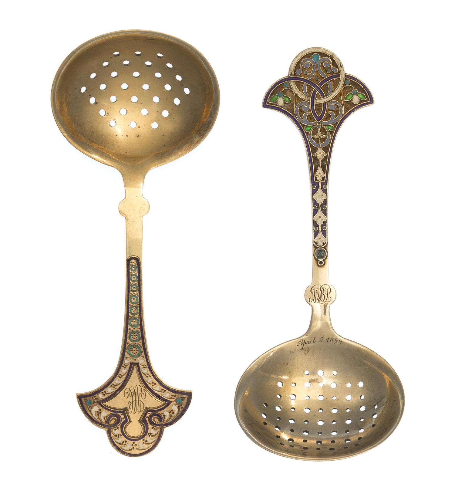 Two Russian Silver-Gilt and Enamel Tea Strainers, Marks likely of Antip Kuzmichev, Moscow, late 19th century, each with a flared handle