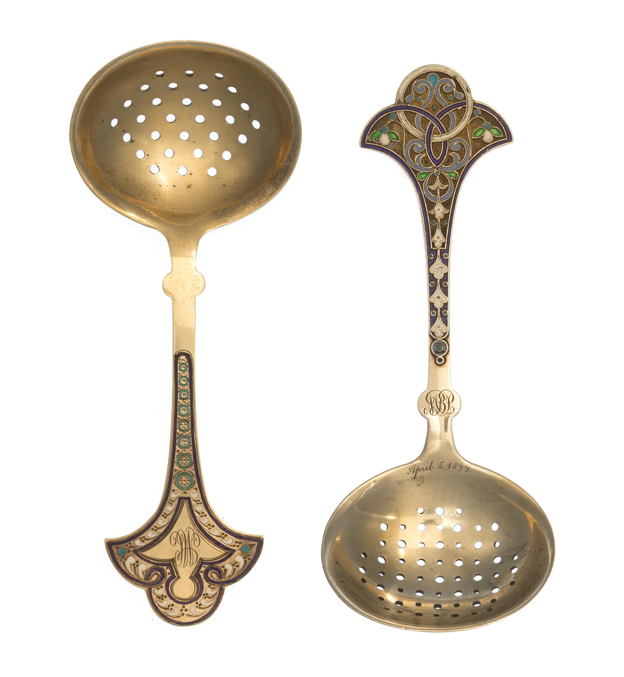 Two Russian Silver-Gilt and Enamel Tea Strainers, Marks likely of Antip Kuzmichev, Moscow, late 19th century, each with a flared handle