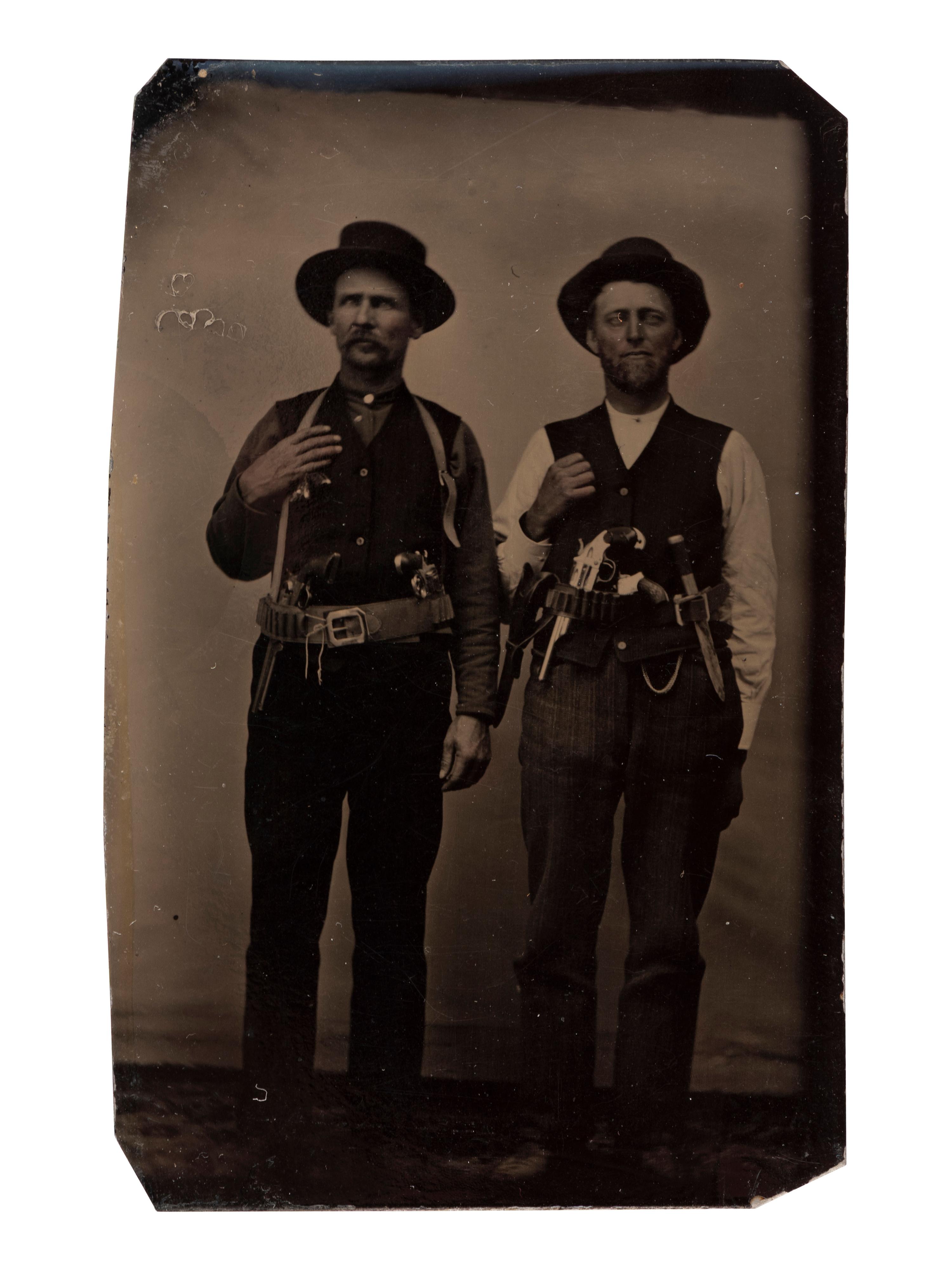 [WESTERN AMERICANA]. Tintype of two heavily armed men, one with rare Merwin, Hulbert & Co. revolver.