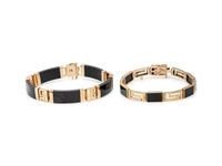 COLLECTION OF YELLOW GOLD AND BLACK JADE JEWELRY