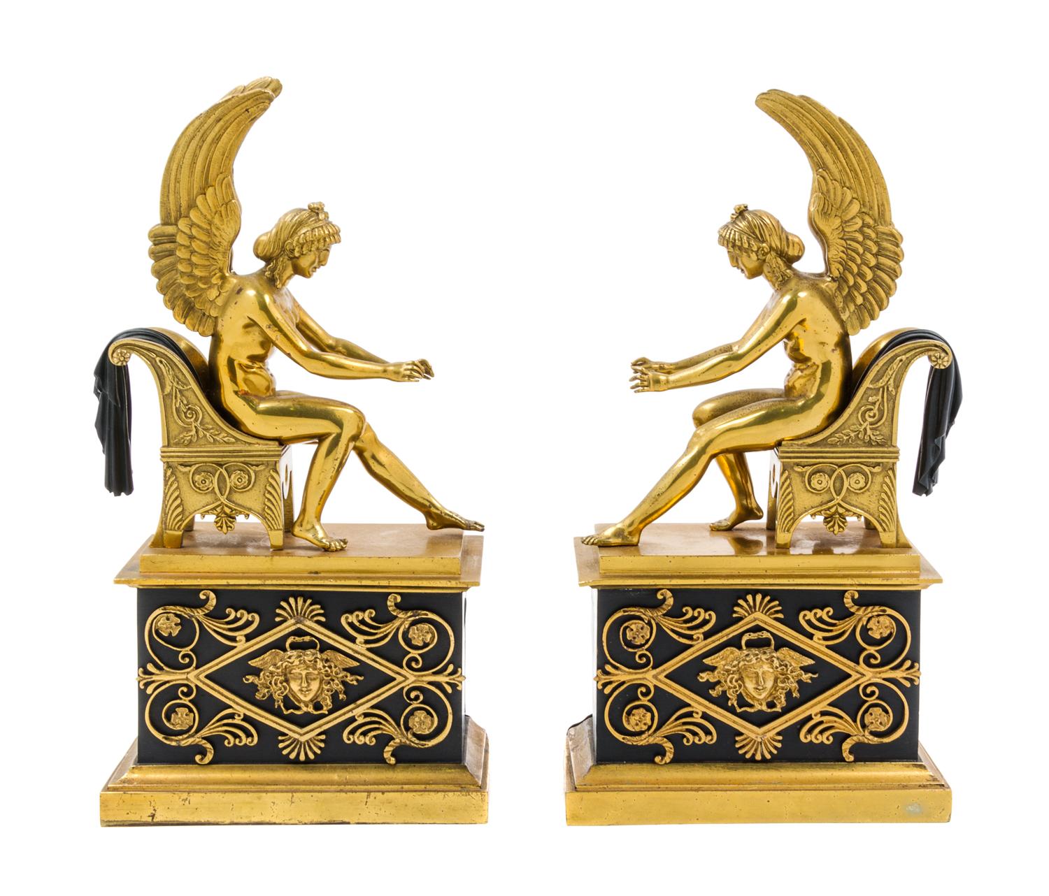 A Pair of Empire Gilt and Patinated Bronze Chenets Height of each 14 1/8 inches. — EARLY 19TH CENTURY