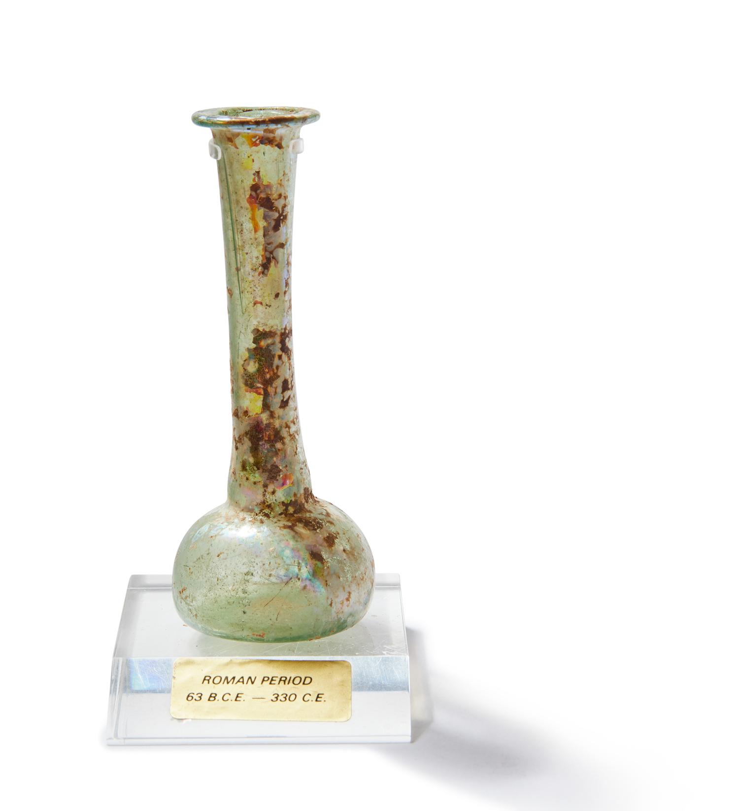 A Roman Green Glass Unguentarium