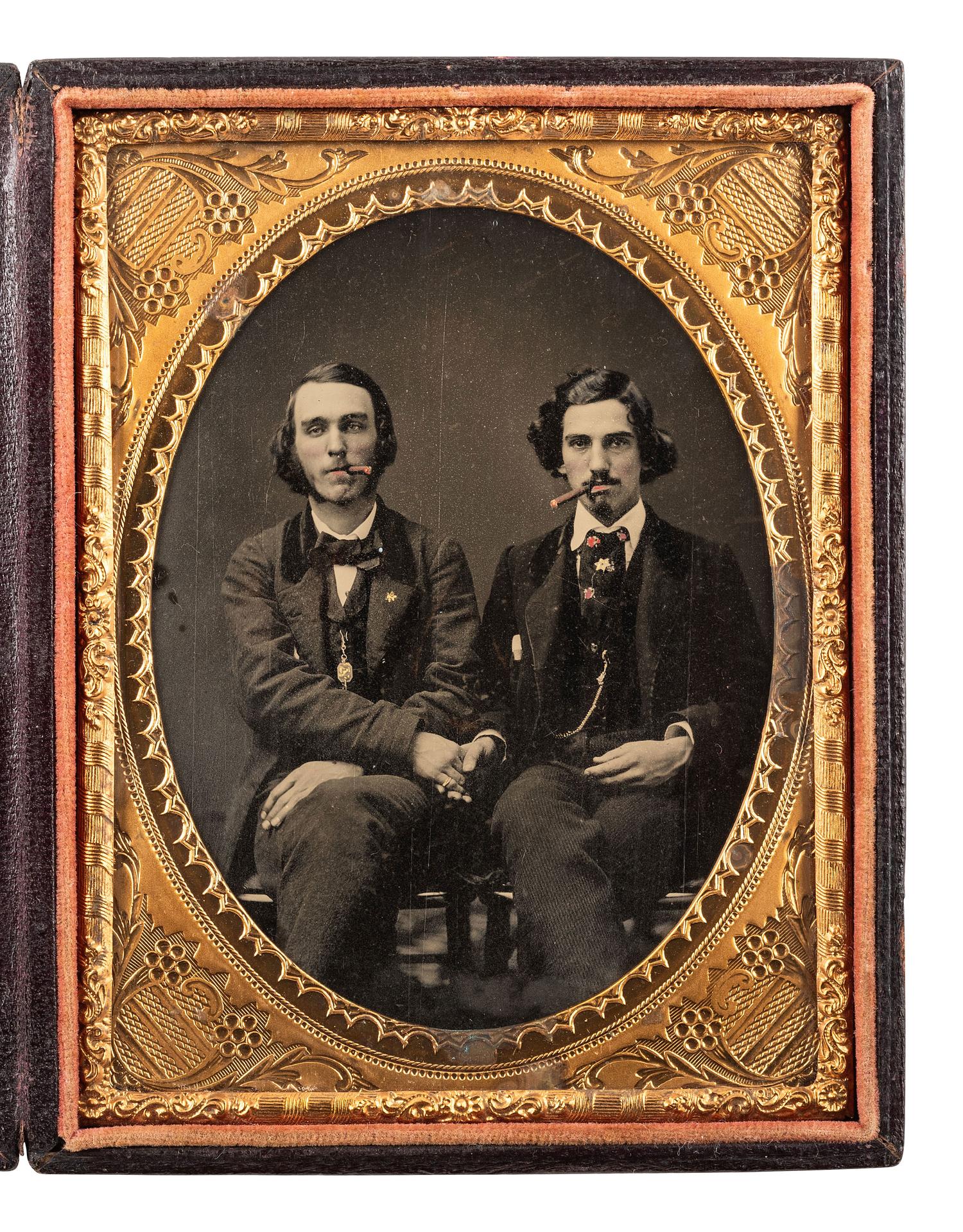 [CIVIL WAR]. Quarter plate ambrotype of two men, possibly brothers, affectionately posed together enjoying a smoke.