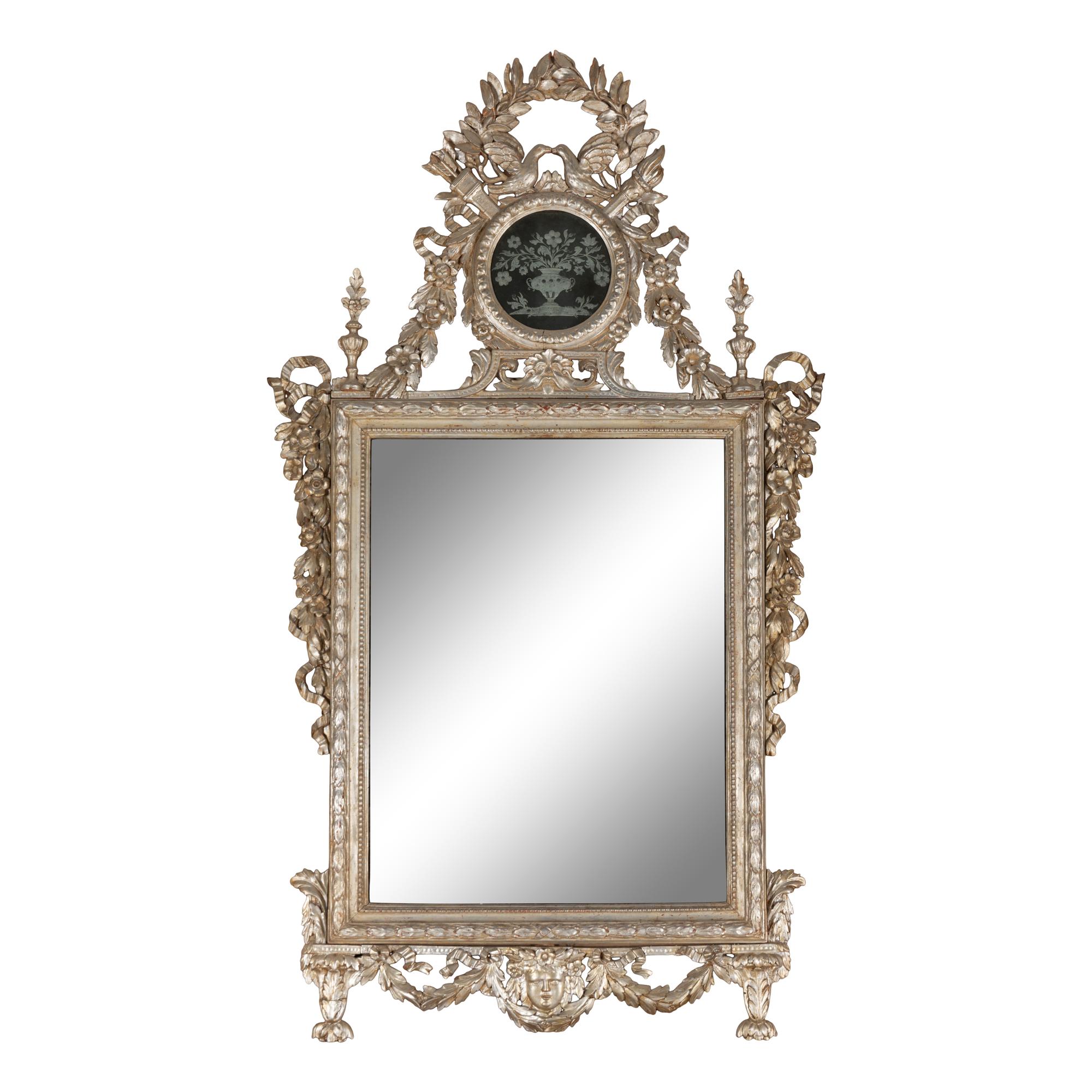 An Italian Silvered Wood and Etched Glass Mirror