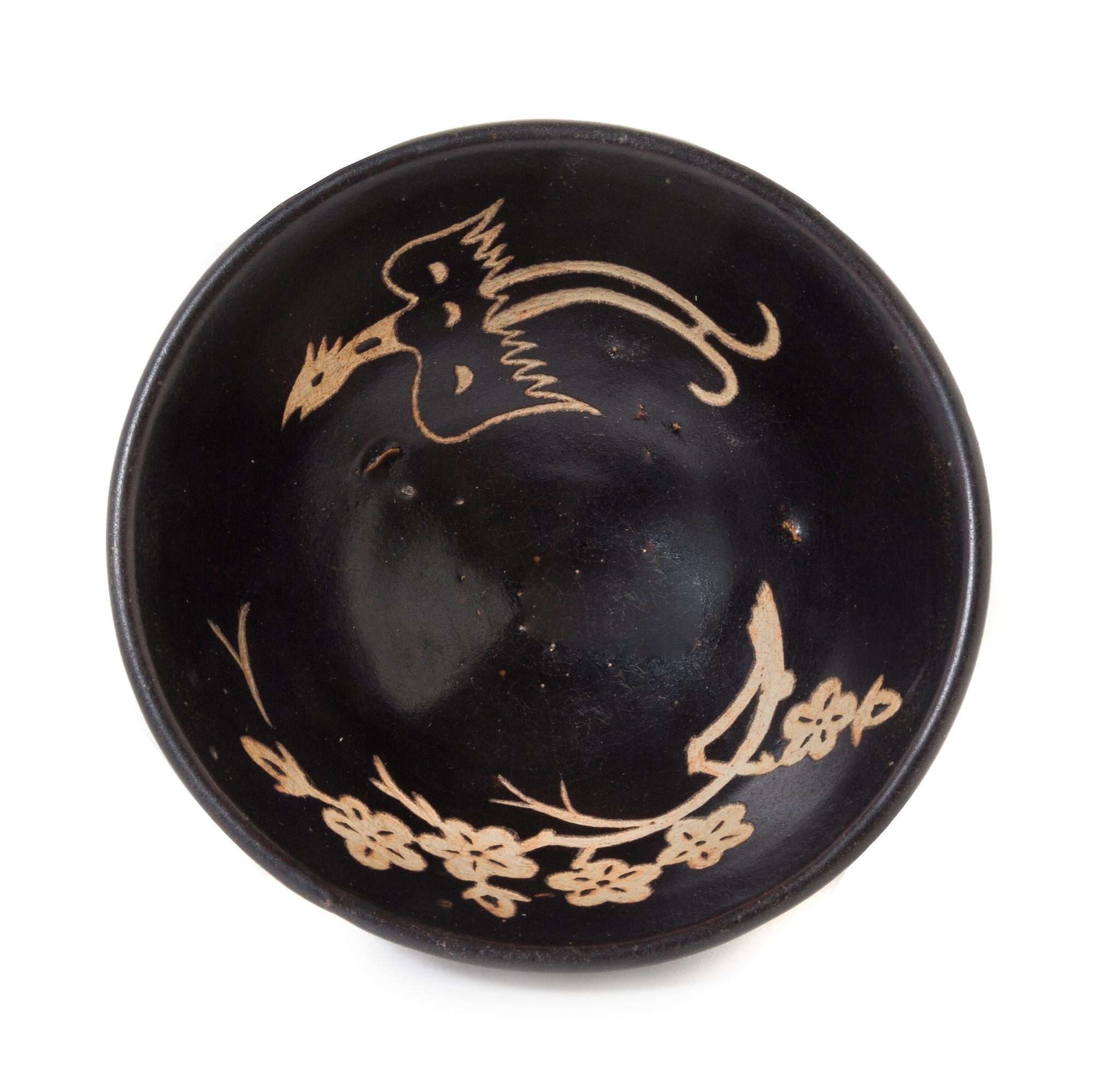 A White Slip Decorated Black Glazed Stoneware Bowl