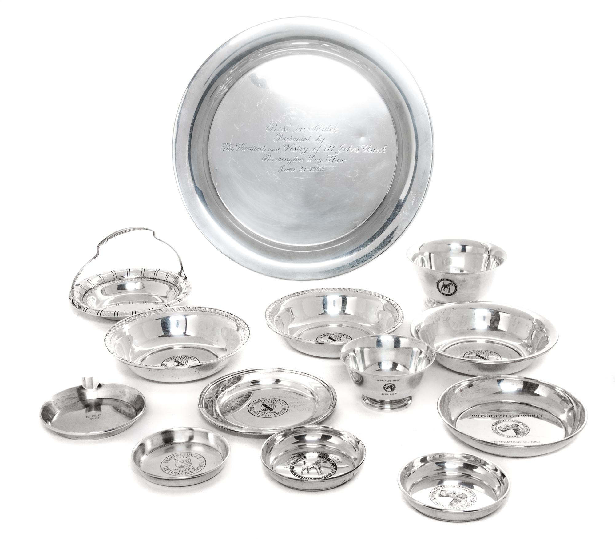Fourteen American Silver Airedale Terrier Articles, Various Makers, comprising a variety of trophy bowls and trays.
