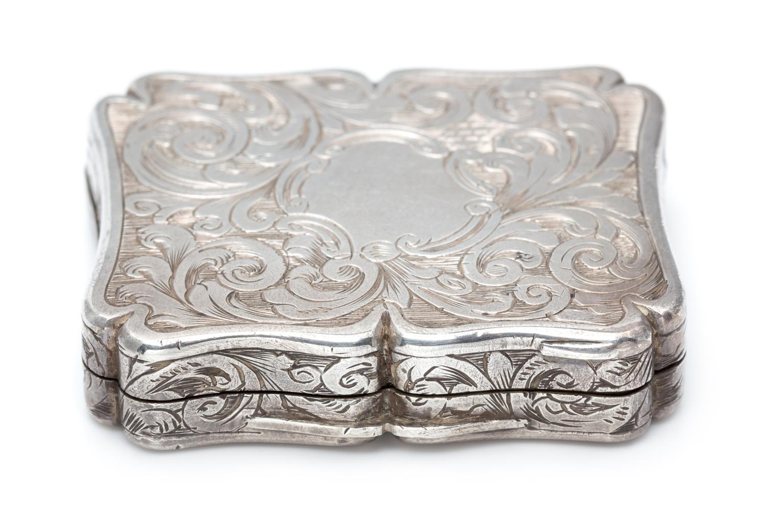 A Victorian Silver Vinaigrette, Edward Smith, Birmingham, 1843, the lid worked to depict a cathedral.