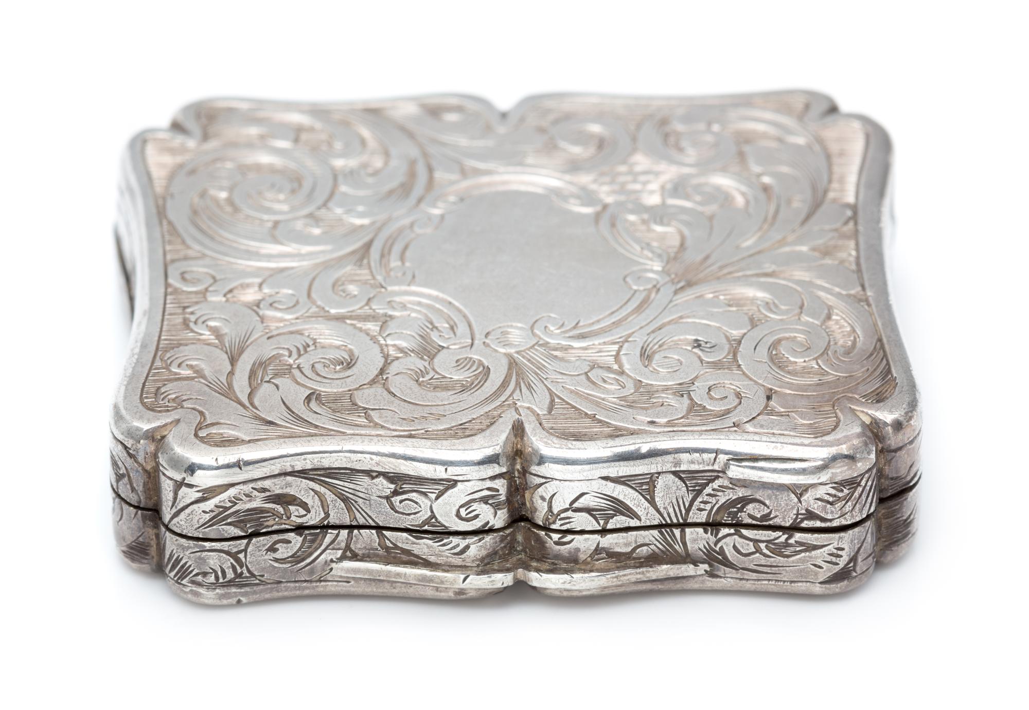 A Victorian Silver Vinaigrette, Edward Smith, Birmingham, 1843, the lid worked to depict a cathedral.