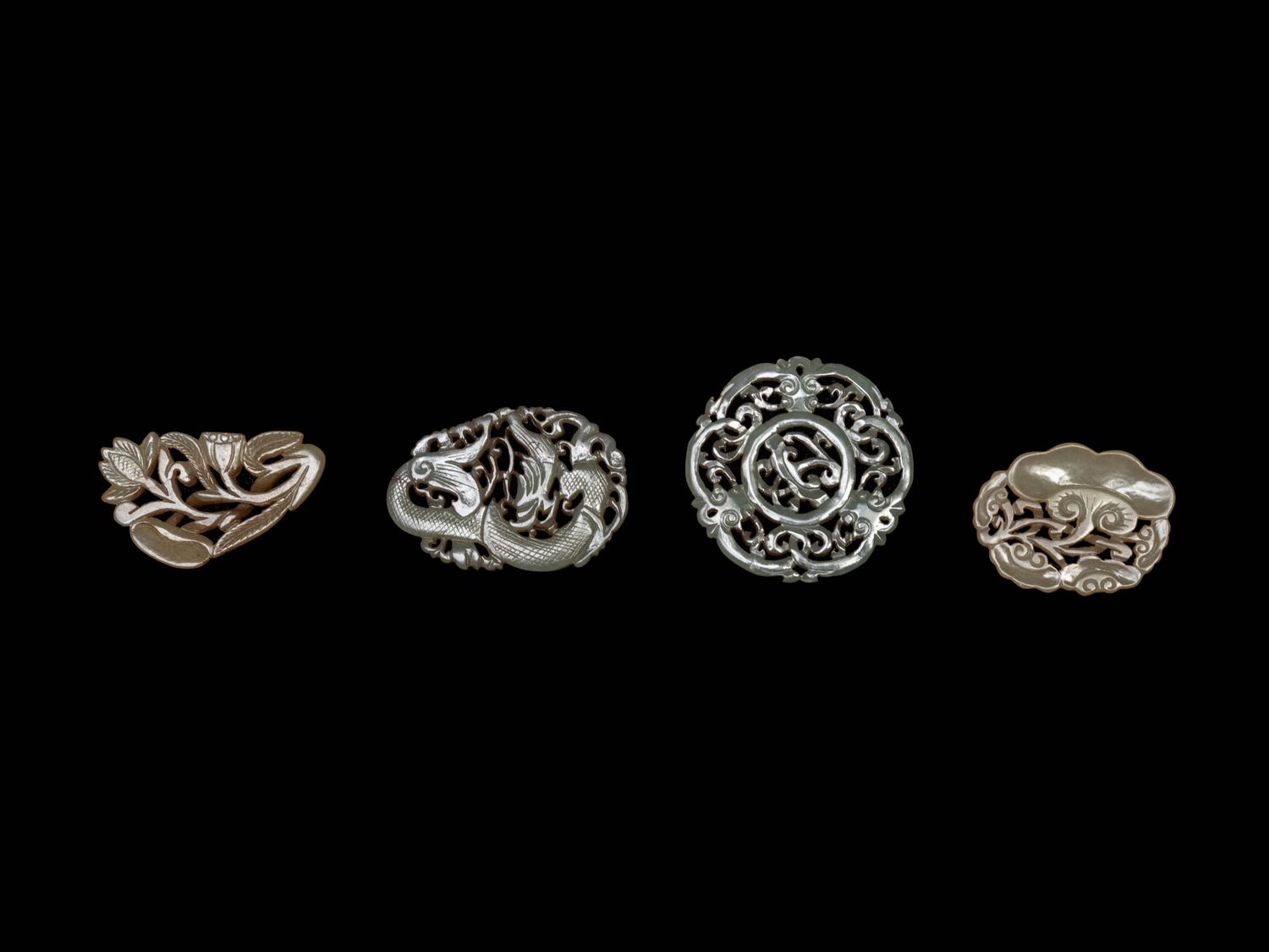 Four Chinese Celadon Jade Reticulated Carvings