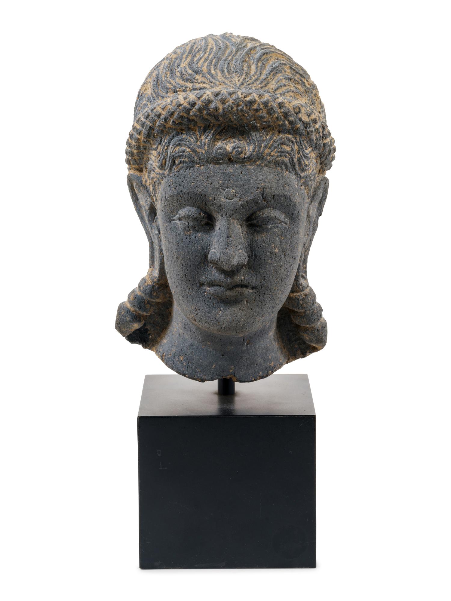 A Life Size Gandharan Grey Schist Head of the Goddess Hariti