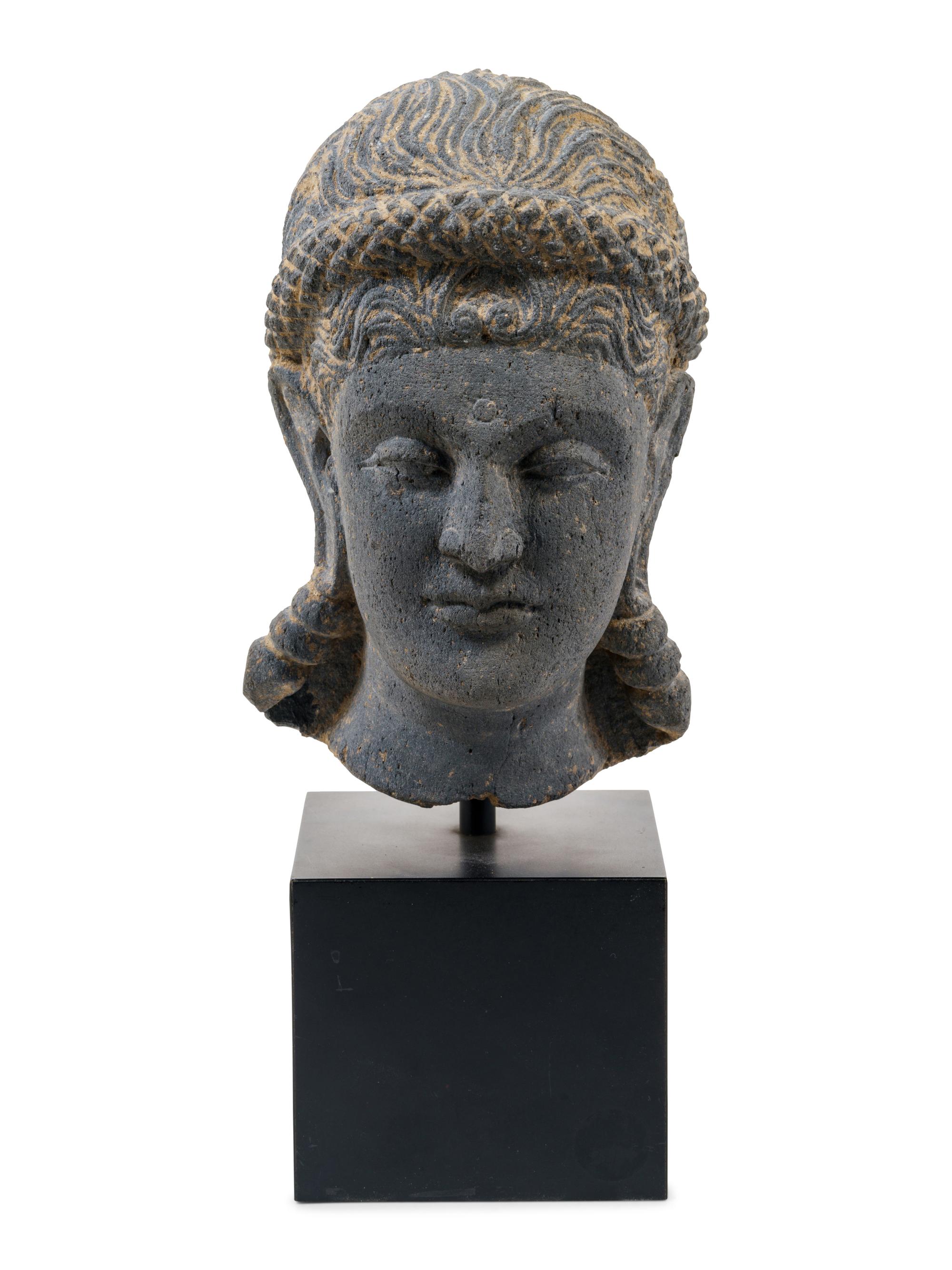 A Life Size Gandharan Grey Schist Head of the Goddess Hariti