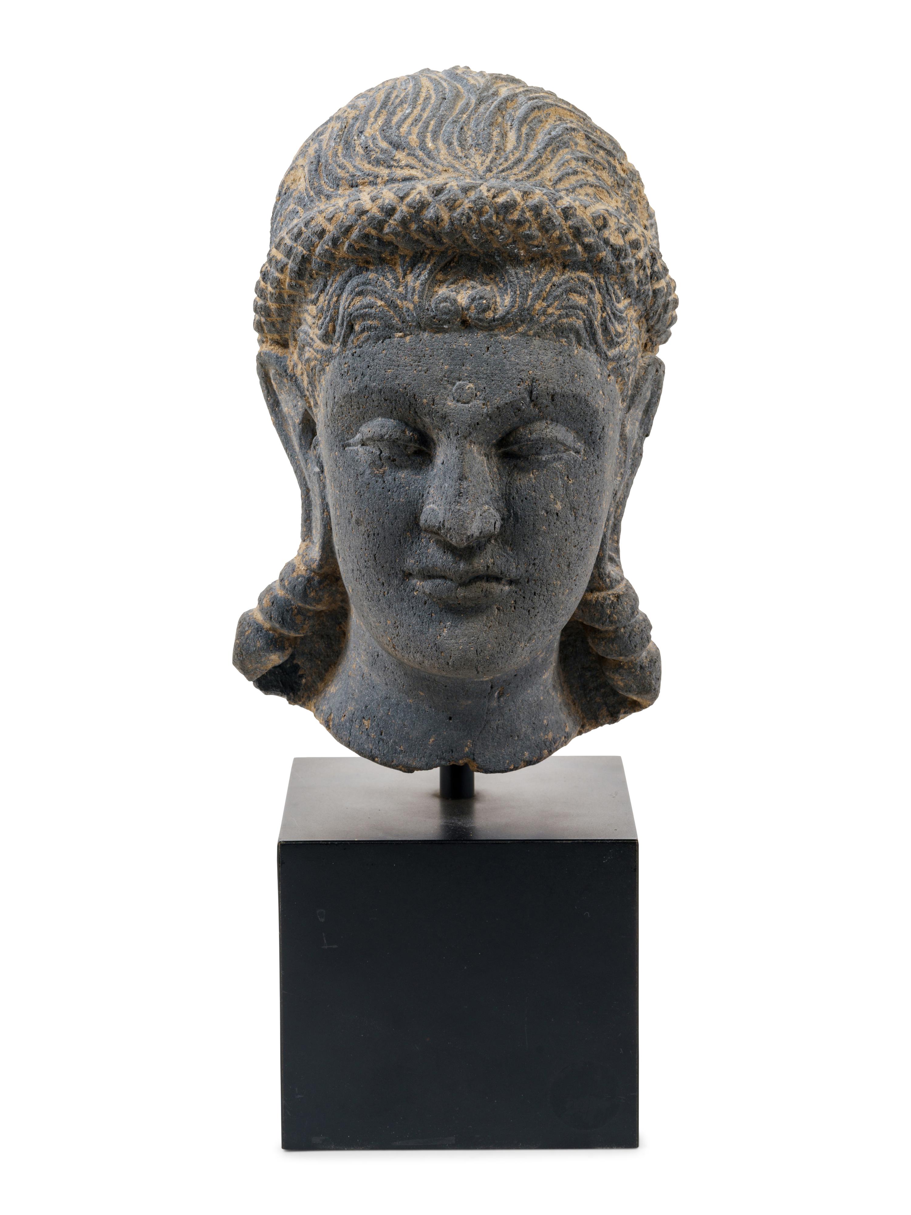 A Life Size Gandharan Grey Schist Head of the Goddess Hariti