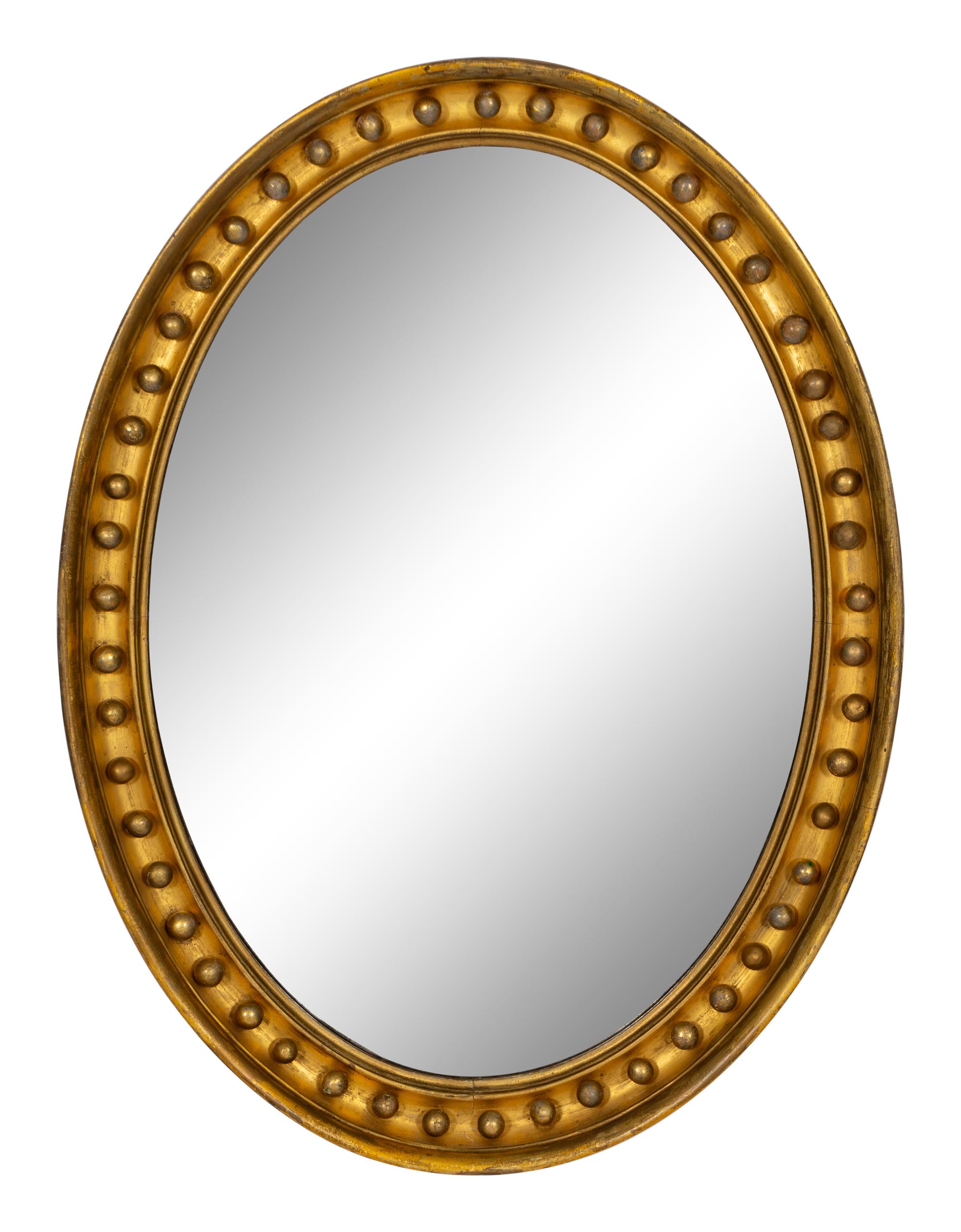 A Regency Style Oval Giltwood Mirror