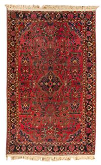 A Sarouk Wool Rug 6 feet 8 inches x 4 feet 5 inches.
