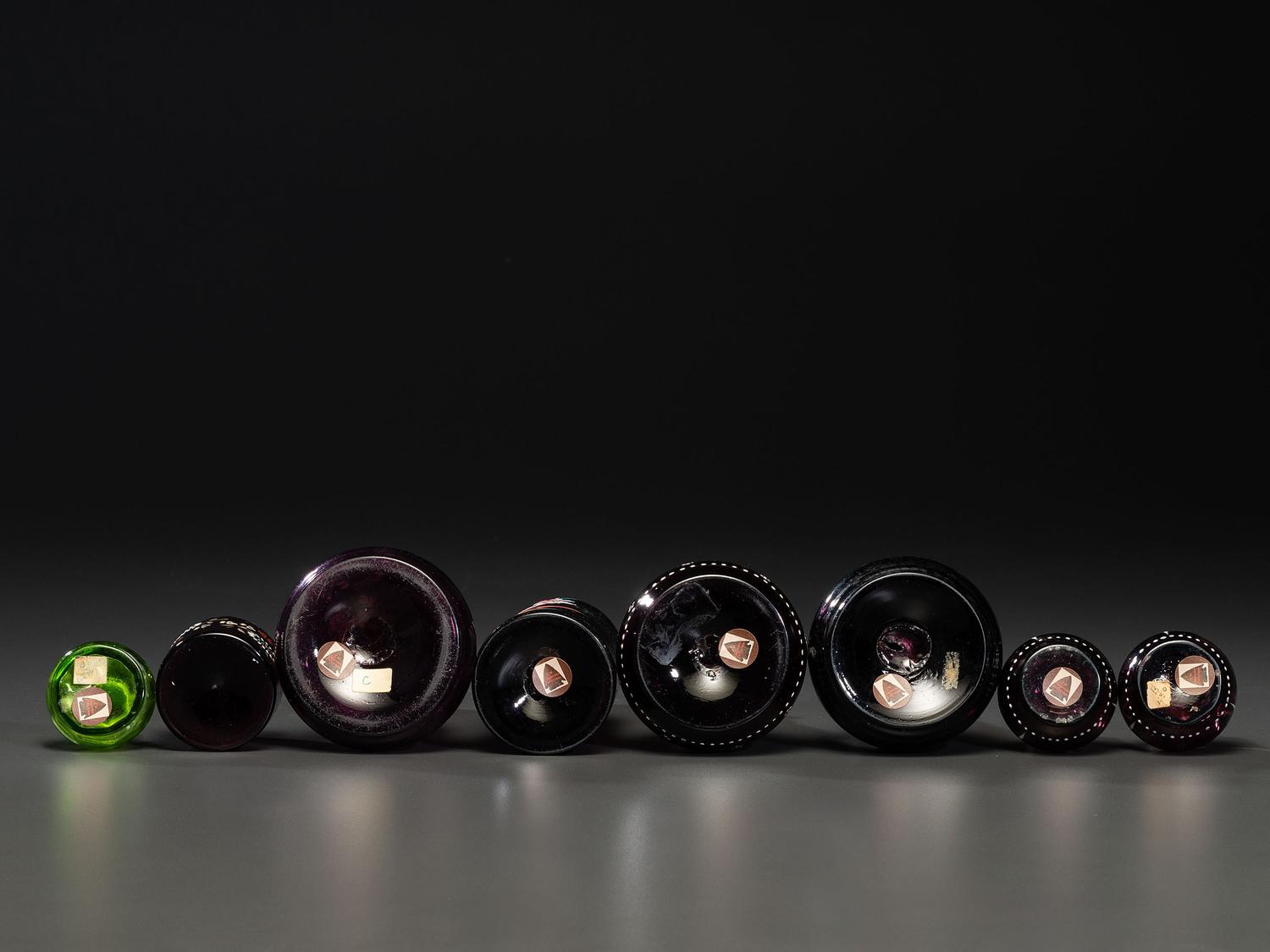 Eight Enameled Amethyst Glass Barber's Items