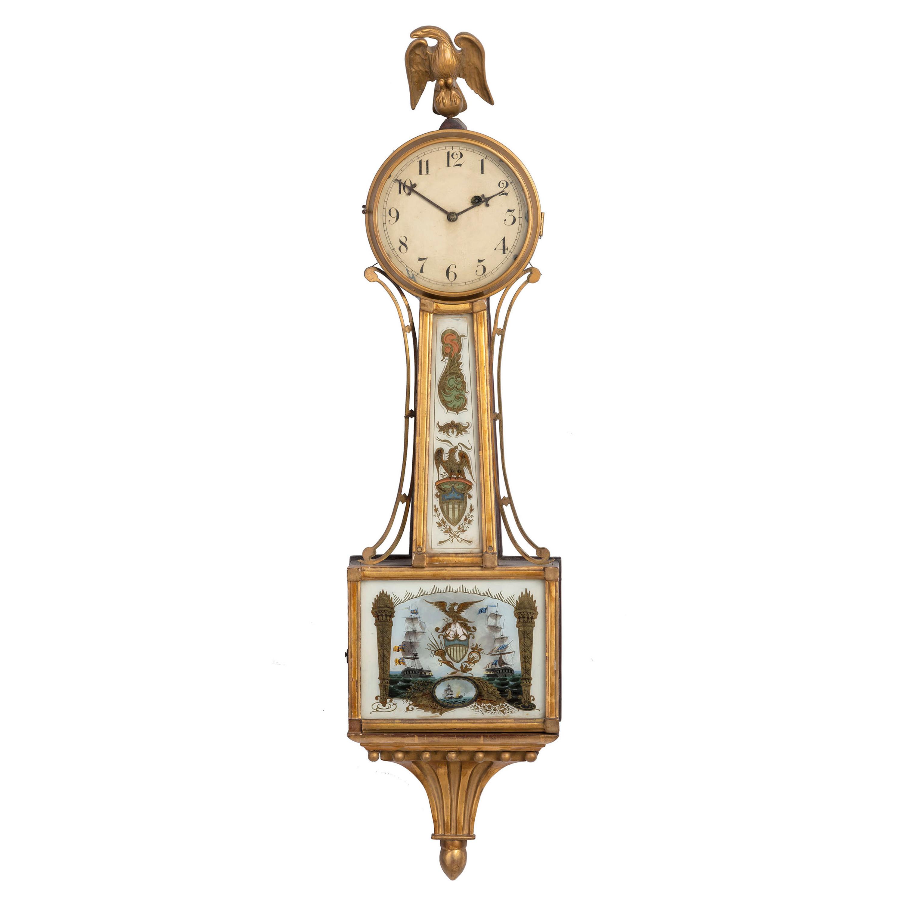 A Classical Eglomise Panel Inset Parcel-Gilt Decorated Mahogany USS Constitution Wall Clock