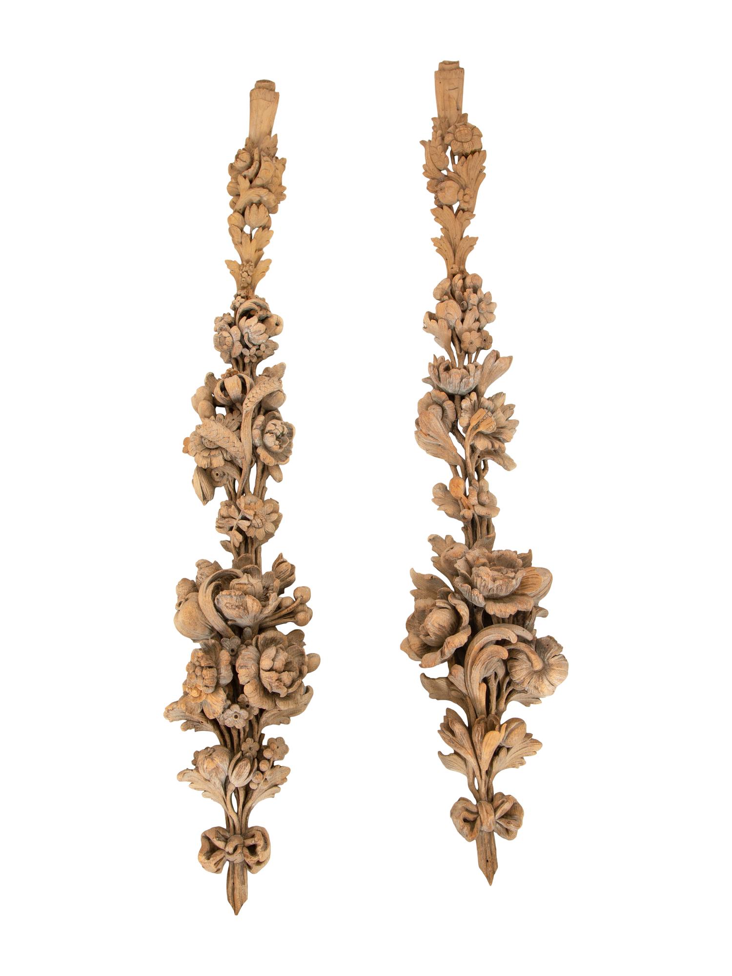 A Pair of Continental Carved Limed Oak Boiserie Swag Wall Appliques